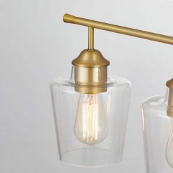 30.25 in. 4-Light Antique Brass Vanity Light with Clear Glass Shade by Kawoti -Safavieh Sales antique brass kawoti vanity lighting 21050 4f 1000