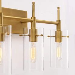 27.5 in. 4-Light Antique Brass Cylindrical Vanity Light with Clear Glass Shade by Kawoti 17 27.5 in. 4-Light Antique Brass Cylindrical Vanity Light with Clear Glass Shade by Kawoti -Safavieh Sales antique brass kawoti vanity lighting 21125 44 1000