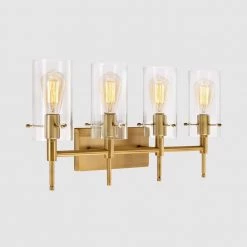 27.5 in. 4-Light Antique Brass Cylindrical Vanity Light with Clear Glass Shade by Kawoti 15 27.5 in. 4-Light Antique Brass Cylindrical Vanity Light with Clear Glass Shade by Kawoti -Safavieh Sales antique brass kawoti vanity lighting 21125 4f 1000