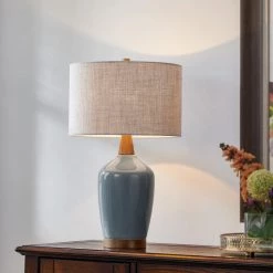 22 .5 in. Ceramic Table Lamp in Brilliant Blue with Walnut Wood Decorates by Kawoti 15 22 .5 in. Ceramic Table Lamp in Brilliant Blue with Walnut Wood Decorates by Kawoti -Safavieh Sales brilliant blue kawoti table lamps 21108 31 1000